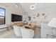 Inviting living room showcases natural light, modern furniture, and vaulted ceilings at 42065 N Cutbow Trl, San Tan Valley, AZ 85140