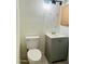 Bathroom with white toilet and sink with gray vanity at 4242 N 69Th Dr # 1303, Phoenix, AZ 85033