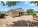 Backyard with patio, desert landscaping, and block fence at 4414 W Monte Way, Laveen, AZ 85339