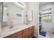Bathroom featuring double sinks, lots of counter space, and a mirrored medicine cabinet at 4414 W Monte Way, Laveen, AZ 85339