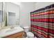 Bathroom features a single sink vanity and a decorative shower curtain at 4414 W Monte Way, Laveen, AZ 85339
