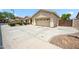 Exterior with a two-car garage, driveway, and desert landscaping at 4414 W Monte Way, Laveen, AZ 85339