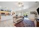 Inviting living room with tile floors and sliding glass doors to the outside patio at 4414 W Monte Way, Laveen, AZ 85339