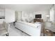 Bright living room with white sofa and modern decor at 47220 W Coe St, Maricopa, AZ 85139