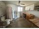 Bathroom with shower, toilet, vanity, and water heater in a functional space at 513 S Cardinal Dr, Apache Junction, AZ 85120
