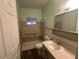 Clean bathroom featuring a shower and grab bars at 513 S Cardinal Dr, Apache Junction, AZ 85120