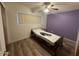 Cozy bedroom with a ceiling fan and window at 513 S Cardinal Dr, Apache Junction, AZ 85120