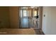 Bright bedroom with a sliding glass door leading to a sunroom at 513 S Cardinal Dr, Apache Junction, AZ 85120