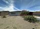 Charming single-story home with desert landscaping and covered parking at 513 S Cardinal Dr, Apache Junction, AZ 85120