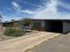 Charming single-story home with desert landscaping and covered parking at 513 S Cardinal Dr, Apache Junction, AZ 85120