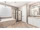 Elegant bathroom featuring a separate shower, soaking tub, and sophisticated design elements at 530 S Emerson St, Chandler, AZ 85225