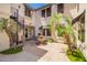 Inviting courtyard featuring a lovely water fountain, lush greenery, and a charming spiral staircase at 530 S Emerson St, Chandler, AZ 85225