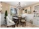 Cozy dining area featuring stone floors, decorative chairs, and a chandelier at 530 S Emerson St, Chandler, AZ 85225