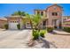 Charming two-story home featuring a brick facade, well-manicured landscaping, and a welcoming entryway at 530 S Emerson St, Chandler, AZ 85225