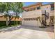 Spacious three car garage with additional outdoor stair access to upper level at 530 S Emerson St, Chandler, AZ 85225