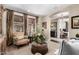Bright living room featuring stylish furniture, a large window, and a view into the dining room at 530 S Emerson St, Chandler, AZ 85225