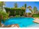 Lush backyard pool featuring mature trees and decorative pergola at 530 S Emerson St, Chandler, AZ 85225
