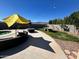 Inviting backyard with lounge area, fire pit, ping pong table, and landscaped yard with mountain views at 5306 N 188Th Ln, Litchfield Park, AZ 85340