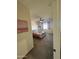 Cozy bedroom with floral bedding, ceiling fan, and natural light, accessible from a hallway at 5306 N 188Th Ln, Litchfield Park, AZ 85340