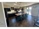 Modern kitchen featuring an island with seating and stainless steel appliances at 5306 N 188Th Ln, Litchfield Park, AZ 85340