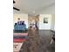 Spacious living room with tile flooring, large windows, and stylish decor at 5306 N 188Th Ln, Litchfield Park, AZ 85340