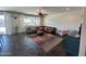 Cozy living room featuring a comfortable leather sectional sofa and a colorful rug at 5306 N 188Th Ln, Litchfield Park, AZ 85340