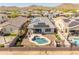 An aerial view shows a house with a private backyard pool, solar panels, and mountain views at 549 E Balao Dr, Phoenix, AZ 85085
