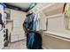 Organized walk-in closet with built-in shelves, hanging rods, and ample storage space at 549 E Balao Dr, Phoenix, AZ 85085