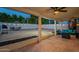 Covered patio extends to a large backyard space, complete with patio furniture and string lights at 6216 W Poinsettia Dr, Glendale, AZ 85304