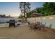 Backyard with a grill and patio set perfect for enjoying outdoor meals with Gathering and friends at 6216 W Poinsettia Dr, Glendale, AZ 85304