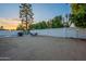 The large backyard offers a spacious area for outdoor enjoyment, featuring a dining area, BBQ grill, and ample space at 6216 W Poinsettia Dr, Glendale, AZ 85304