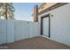The spacious backyard features low maintenance gravel and access to the back door of the home at 6216 W Poinsettia Dr, Glendale, AZ 85304
