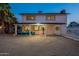 Backyard featuring a covered patio with cozy seating, offering a relaxing outdoor space at 6216 W Poinsettia Dr, Glendale, AZ 85304