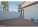 The spacious backyard features low maintenance gravel and an energy efficient cooling system at 6216 W Poinsettia Dr, Glendale, AZ 85304