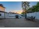 Inviting backyard featuring a grill, seating area, string lights and a view of the sunset at 6216 W Poinsettia Dr, Glendale, AZ 85304