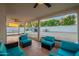 The spacious backyard features a covered patio, outdoor seating, grill, and an open area for outdoor activities at 6216 W Poinsettia Dr, Glendale, AZ 85304