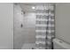 Modern bathroom showcasing a walk-in shower with stylish fixtures and tiled walls at 6216 W Poinsettia Dr, Glendale, AZ 85304