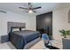 Comfortable bedroom with a fireplace, ceiling fan, and tile flooring at 6216 W Poinsettia Dr, Glendale, AZ 85304
