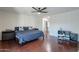 Bedroom features wood floors and a desk area offering plenty of bright, natural lighting at 6216 W Poinsettia Dr, Glendale, AZ 85304