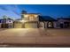 Charming home featuring a three-car garage, second story balcony and solar panels at 6216 W Poinsettia Dr, Glendale, AZ 85304