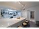 White kitchen featuring quartz countertops, stainless appliances, and ample counter space at 6216 W Poinsettia Dr, Glendale, AZ 85304