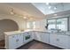 Updated kitchen with quartz countertops, stainless appliances, and plenty of storage at 6216 W Poinsettia Dr, Glendale, AZ 85304