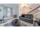 Inviting living room with leather sofa, stylish coffee table, and lots of natural light at 6216 W Poinsettia Dr, Glendale, AZ 85304