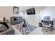 Comfortable living room with vaulted ceilings, modern tile floors and contemporary decor at 6216 W Poinsettia Dr, Glendale, AZ 85304