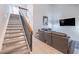 Open-concept living area features vaulted ceilings, stairs and modern tile floors at 6216 W Poinsettia Dr, Glendale, AZ 85304