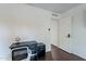 Bright home office featuring dark wood flooring and an organized workspace at 6216 W Poinsettia Dr, Glendale, AZ 85304