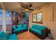 Inviting covered patio with plush seating, offering an ideal space for outdoor relaxation and entertainment at 6216 W Poinsettia Dr, Glendale, AZ 85304