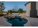 Inviting pool area with string lights, a fire pit, and views of the home, perfect for relaxation and entertainment at 6216 W Poinsettia Dr, Glendale, AZ 85304