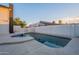 Sparkling swimming pool offers a refreshing escape, surrounded by a concrete deck and privacy fence at 6216 W Poinsettia Dr, Glendale, AZ 85304