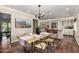 Open dining room with hardwood floors, modern furnishings, adjacent to the kitchen area at 709 E Hayward Ave, Phoenix, AZ 85020